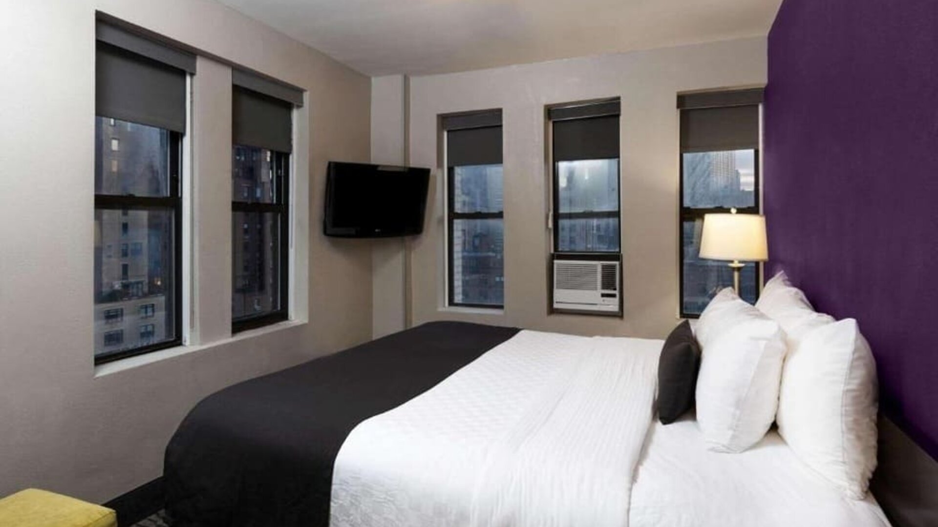 Day use room with a television and a view of the city at La Quinta Inn & Suites By Wyndham New York City Central Park.