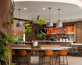 Stylish bar at EVEN Hotel Brooklyn By IHG, ideal for unwinding after a busy day.