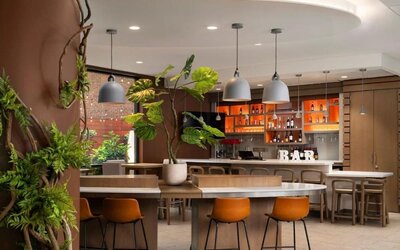 Stylish bar at EVEN Hotel Brooklyn By IHG, ideal for unwinding after a busy day.