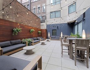 Beautiful exterior with ample seating, perfect for enjoying a New York evening at EVEN Hotel Brooklyn By IHG.