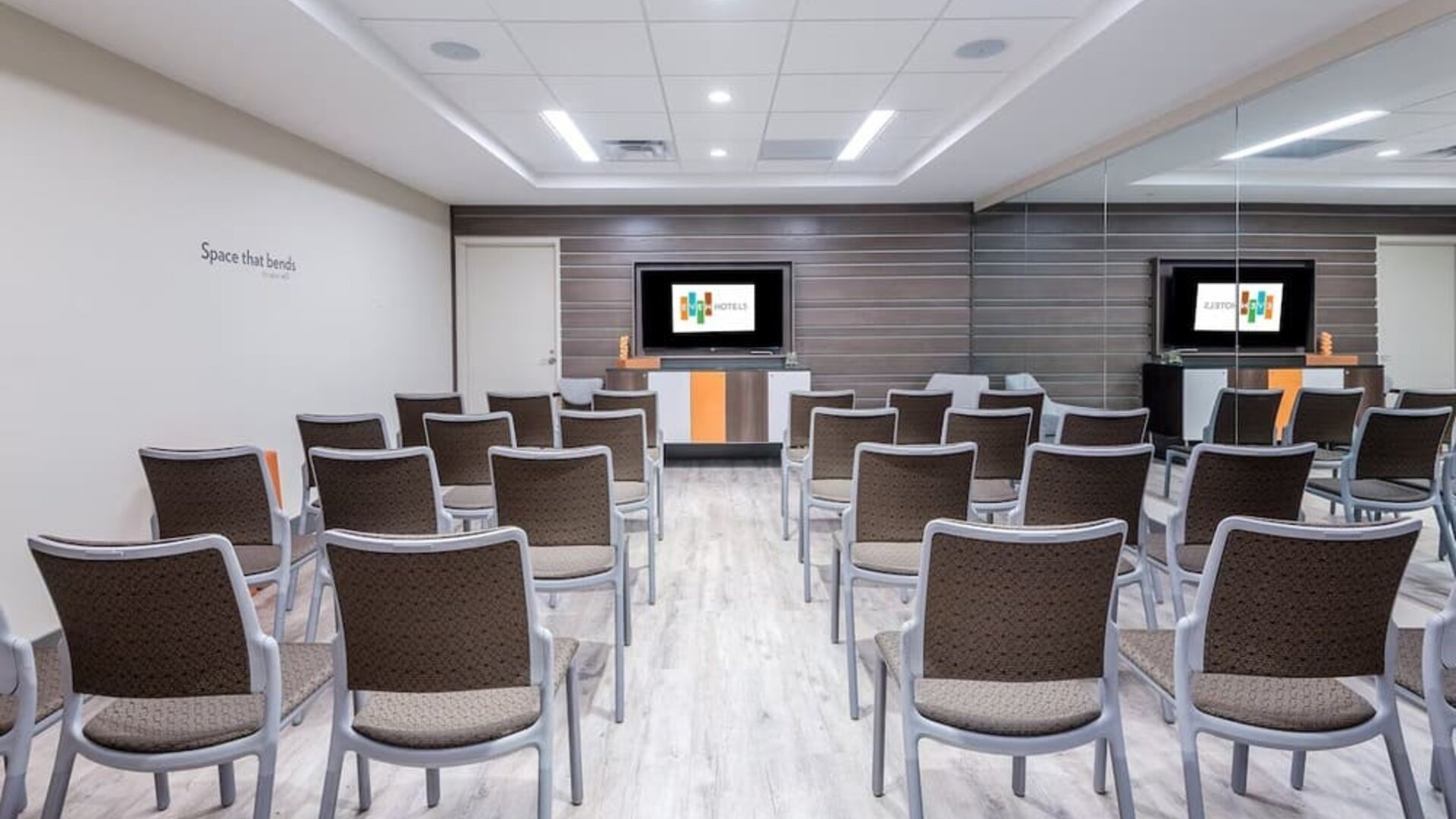 Spacious meeting room perfect for presentations and training at EVEN Hotel Brooklyn By IHG