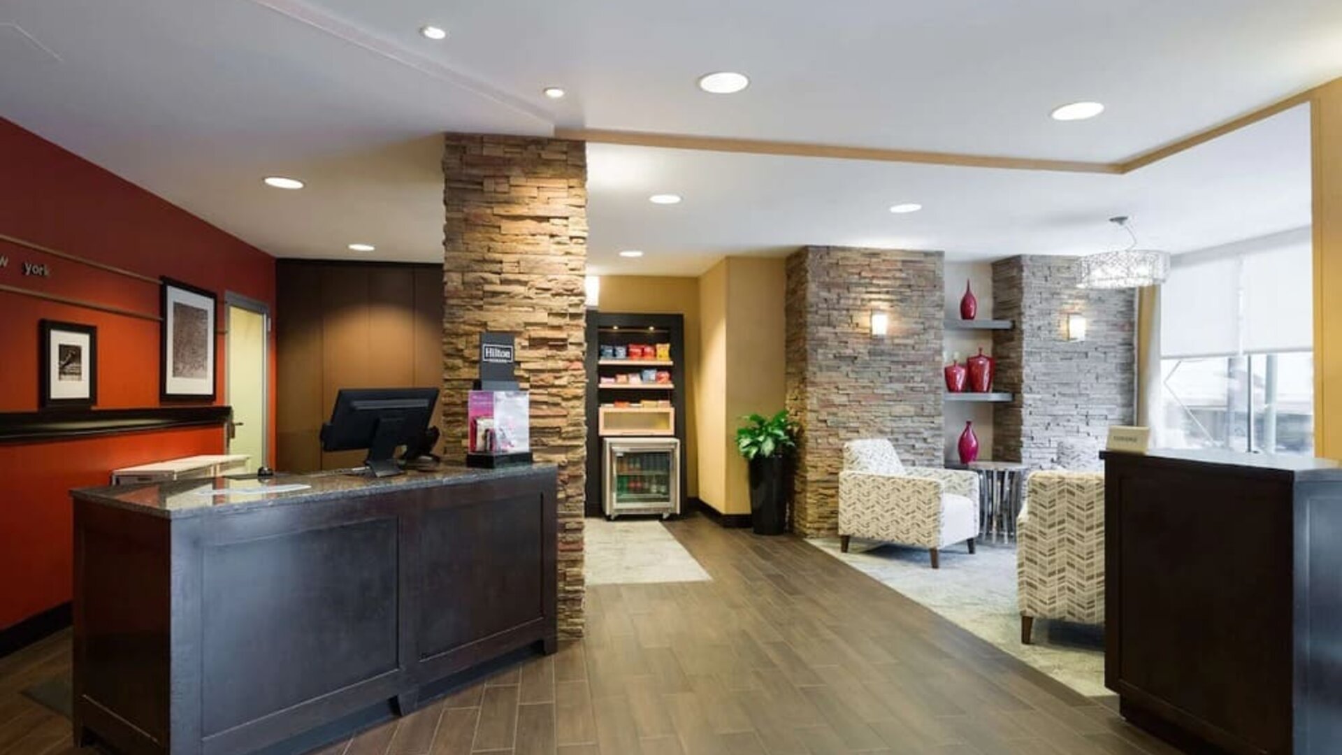 Welcoming reception with comfortable seating at Hampton Inn Times Square South.