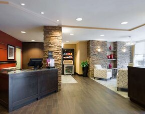 Welcoming reception with comfortable seating at Hampton Inn Times Square South.