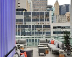 Terrace with ample seats perfect for coworking at The Bernic Hotel New York City, Tapestry Collection By Hilton.