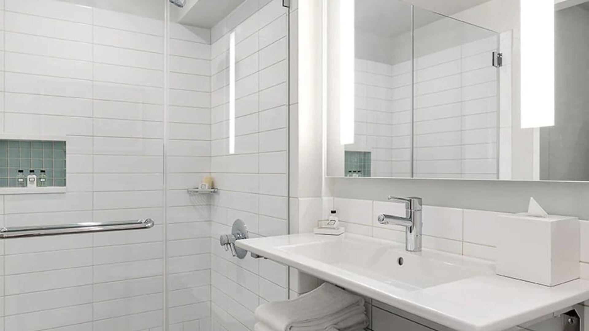 Modern bathroom with plush towels at Hotel 48LEX New York.