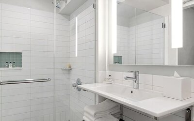 Modern bathroom with plush towels at Hotel 48LEX New York.