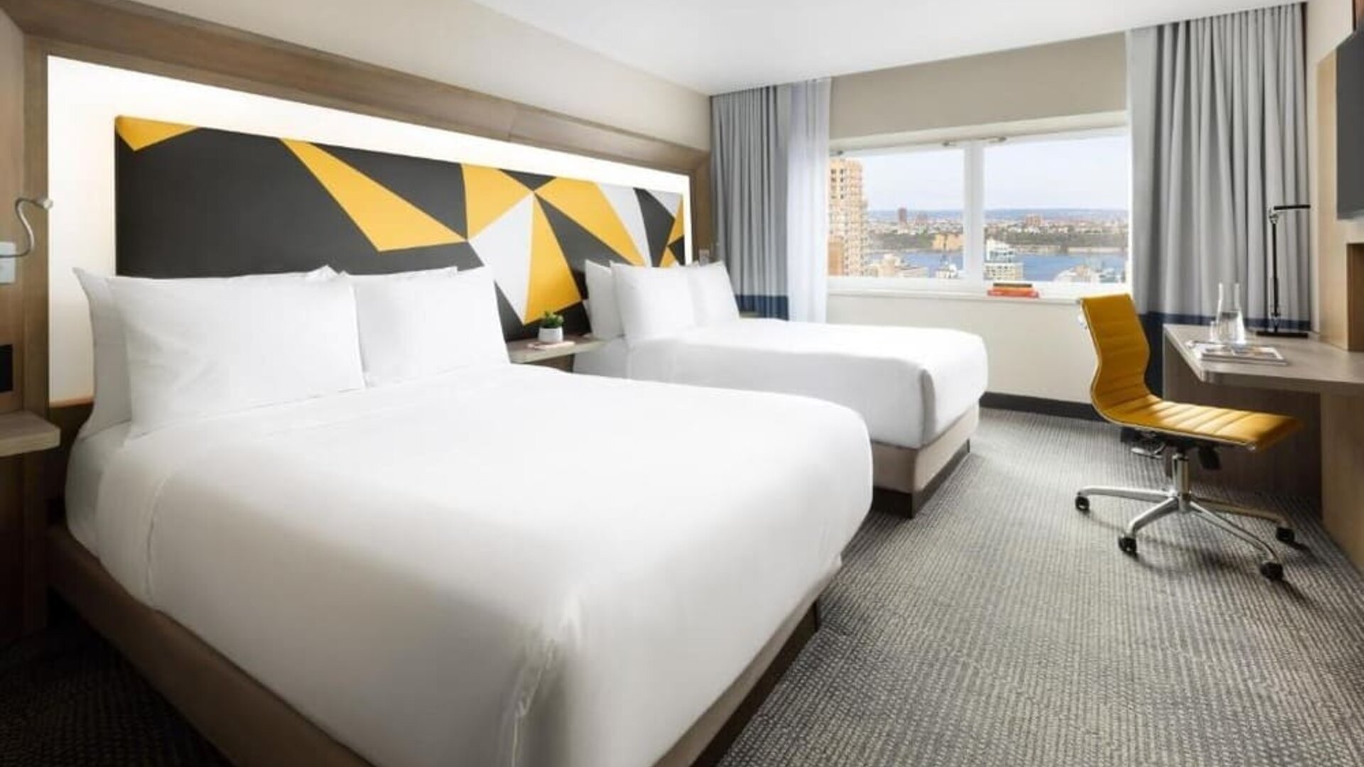 Day use room with workspace and natural light at M Social Hotel Times Square.