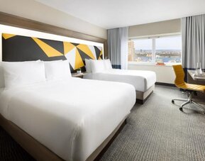 Day use room with workspace and natural light at M Social Hotel Times Square.