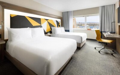 Day use room with workspace and natural light at M Social Hotel Times Square.