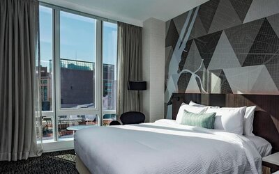 Day use room with workspace and natural light at Courtyard By Marriott Long Island City/New York Manhattan View.