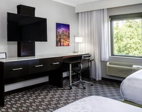 Day use room with work desk at Best Western Premier NYC Gateway.