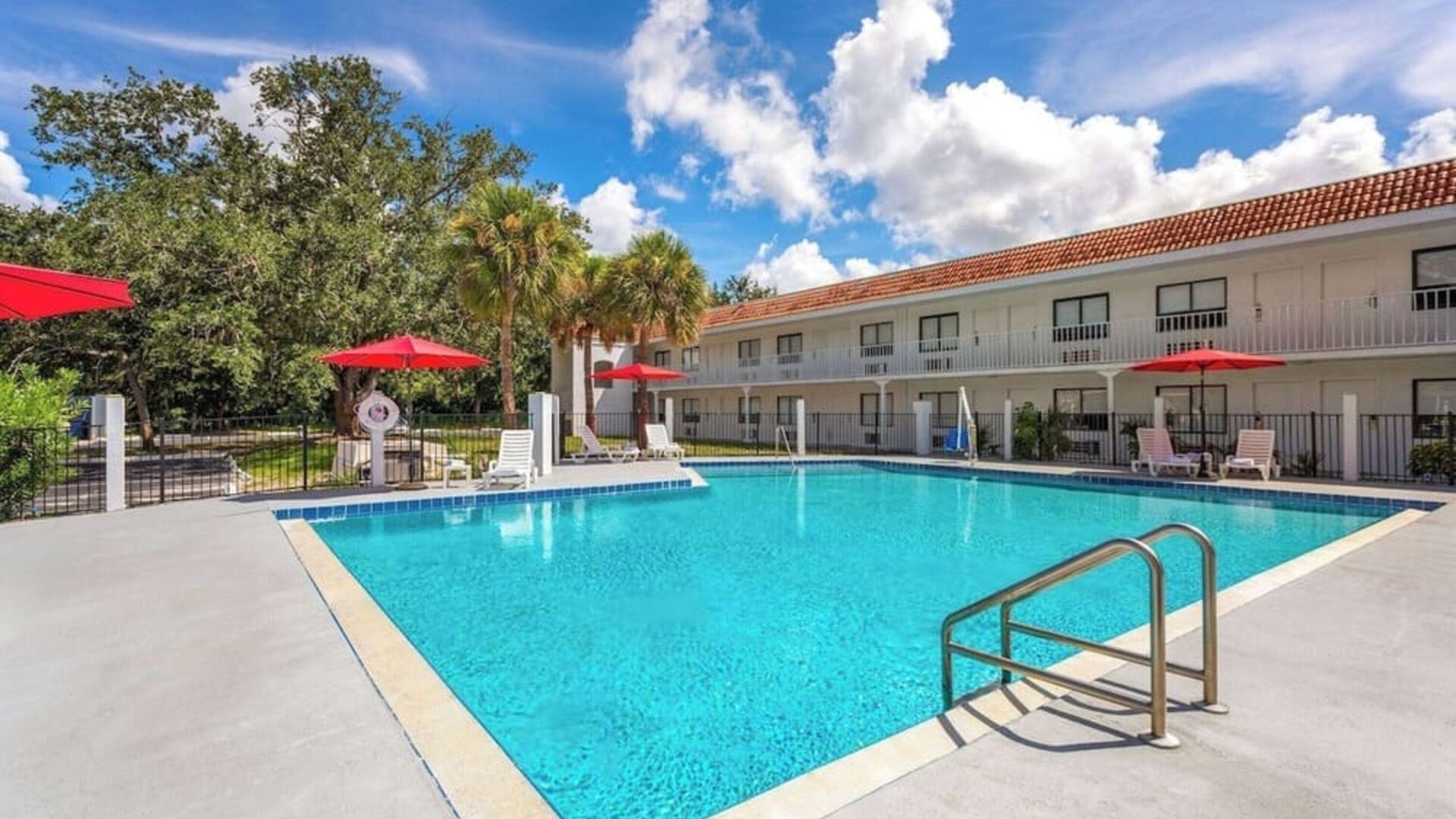 Relaxing outdoor pool at Travelodge by Wyndham Fundamental.