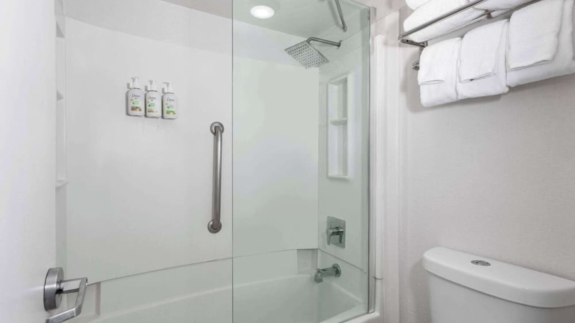Modern bathroom with towels at Baymont by Wyndham Maingate.