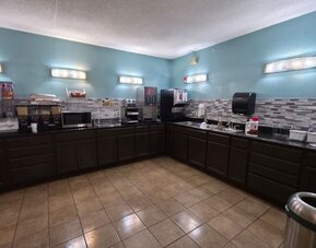 Kitchen area at Coratel Inn And Suites By Jasper Wichita North.