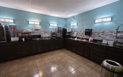 Kitchen area at Coratel Inn And Suites By Jasper Wichita North.