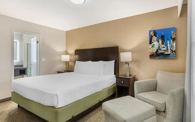 Day room with ensuite and a couch at Best Western Fort Lee.