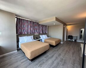 Day use room with work desk at Regal Inn & Suites New York.