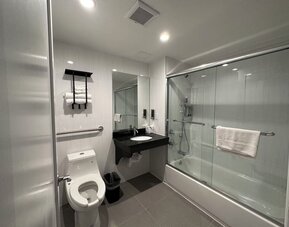 Bathroom at Regal Inn & Suites New York.