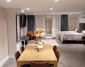 Day room with workspace at Rose Hotel, Bronx.