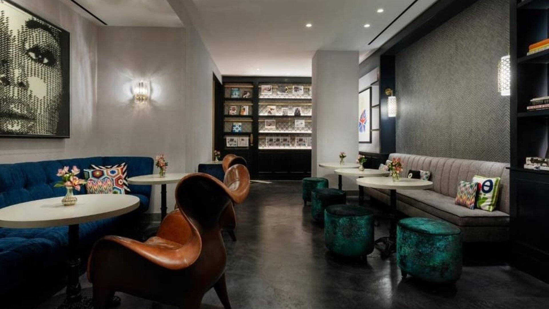 Lounge area with seating, tables, and reading space at Hotel 57.