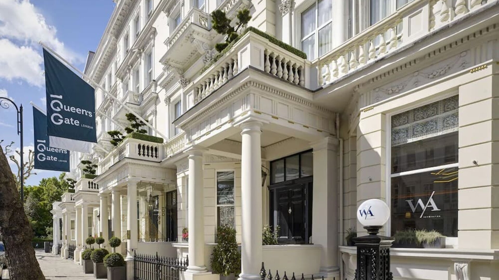 Hotel exterior with white walls at 100 Queen's Gate Hotel London.