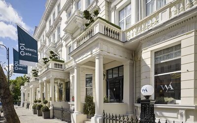 Hotel exterior with white walls at 100 Queen's Gate Hotel London.