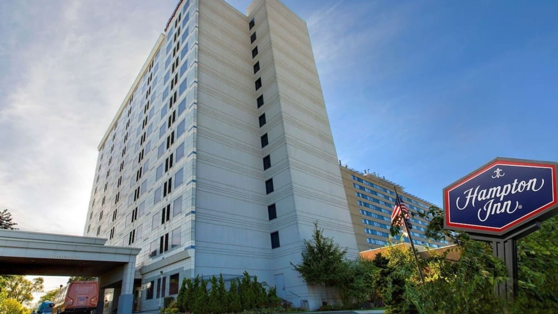 Tall hotel exterior at Hampton Inn NY-JFK.