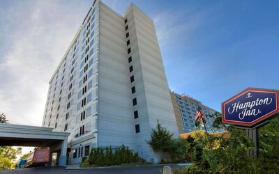 Tall hotel exterior at Hampton Inn NY-JFK.
