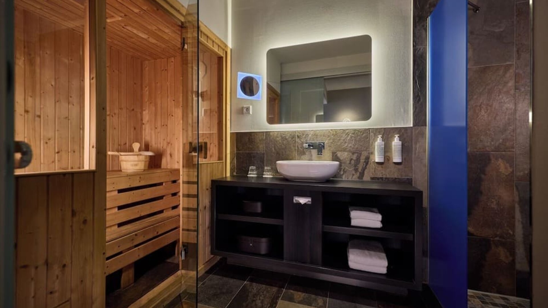 Private bathroom with shower and sauna at Haven Hotel Rotterdam.