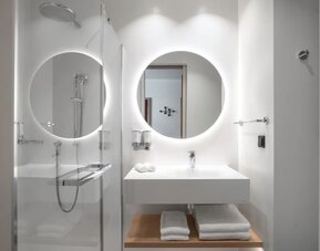 Guest bathroom with shower at Hampton By Hilton Tallinn.