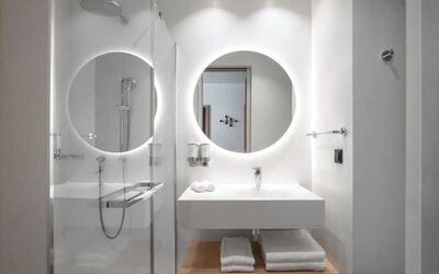 Guest bathroom with shower at Hampton By Hilton Tallinn.