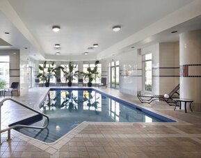 Indoor pool with natural light at Hilton Garden Inn Montreal Airport.