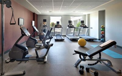 Fitness center complete with equipment at Hilton Garden Inn Montreal Airport.