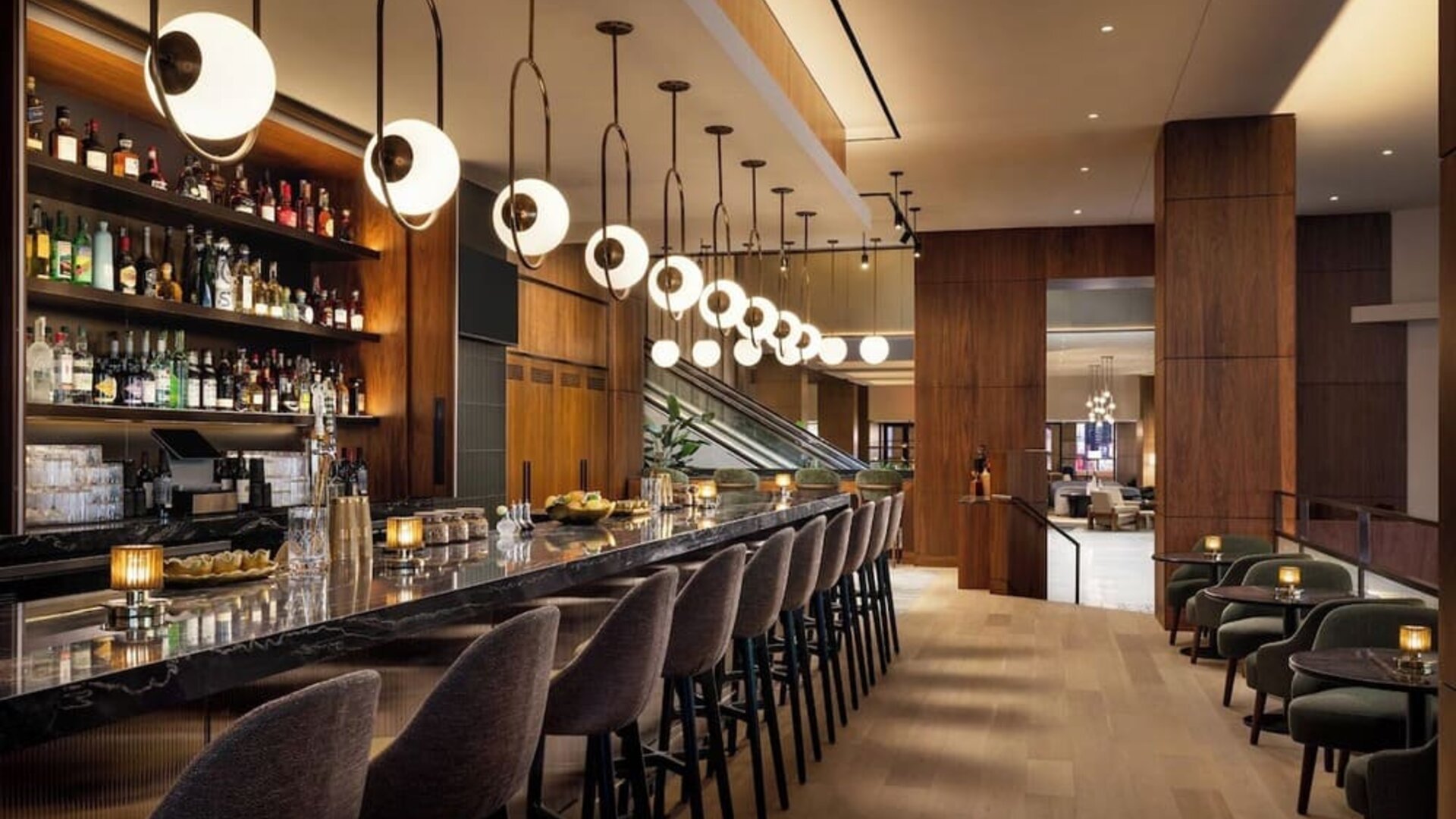 Bar area with seating, pendant lighting, and full-service counter at Hyatt Regency Times Square.