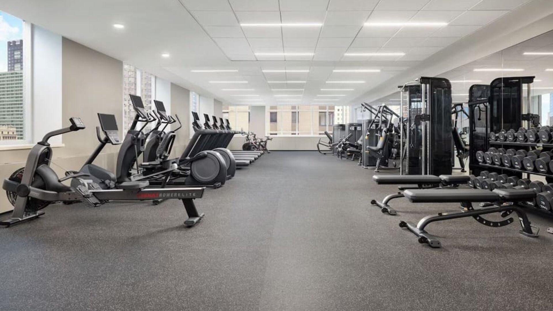 Large gym with cardio machines, weights, and strength equipment at Hyatt Regency Times Square.