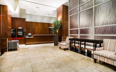 Spacious hotel lobby with seating at Hilton Garden Inn New York/West 35th Street.