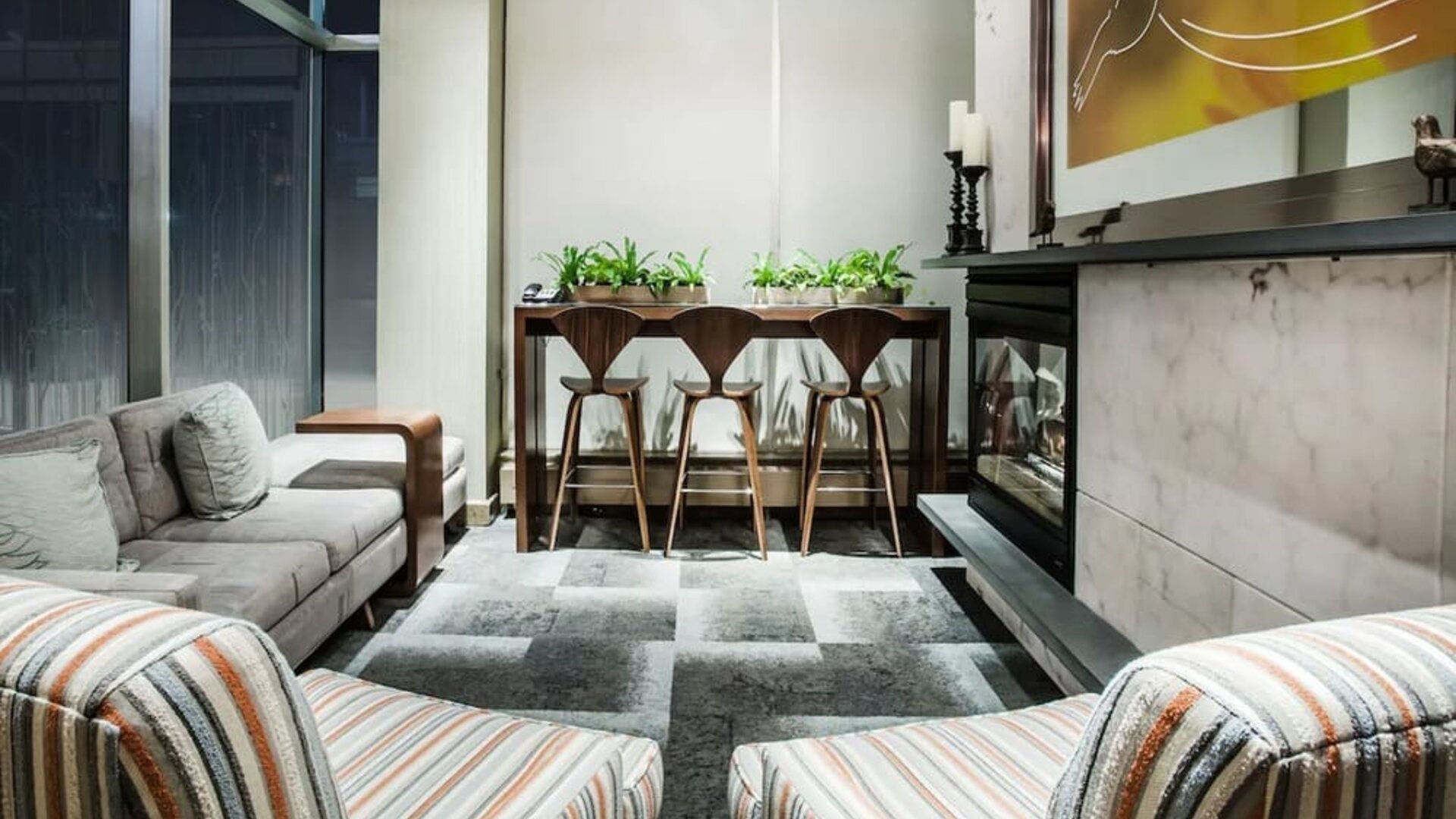 Cozy lobby lounge with fireplace at Hilton Garden Inn New York/West 35th Street.