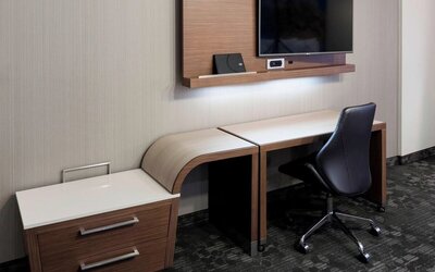 In-room workspace with desk and television at Courtyard By Marriott Houston North/Shenandoah.