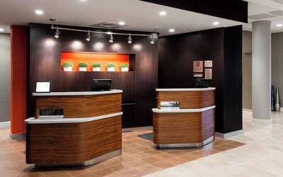 Reception desk and lobby area at Courtyard By Marriott Houston North/Shenandoah.