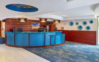Colorful reception desk and lobby area at Courtyard Waikiki Beach.