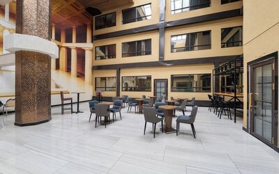 Open atrium seating area inside Hotel Montreal Metropolitan, An Ascend Collection Hotel.