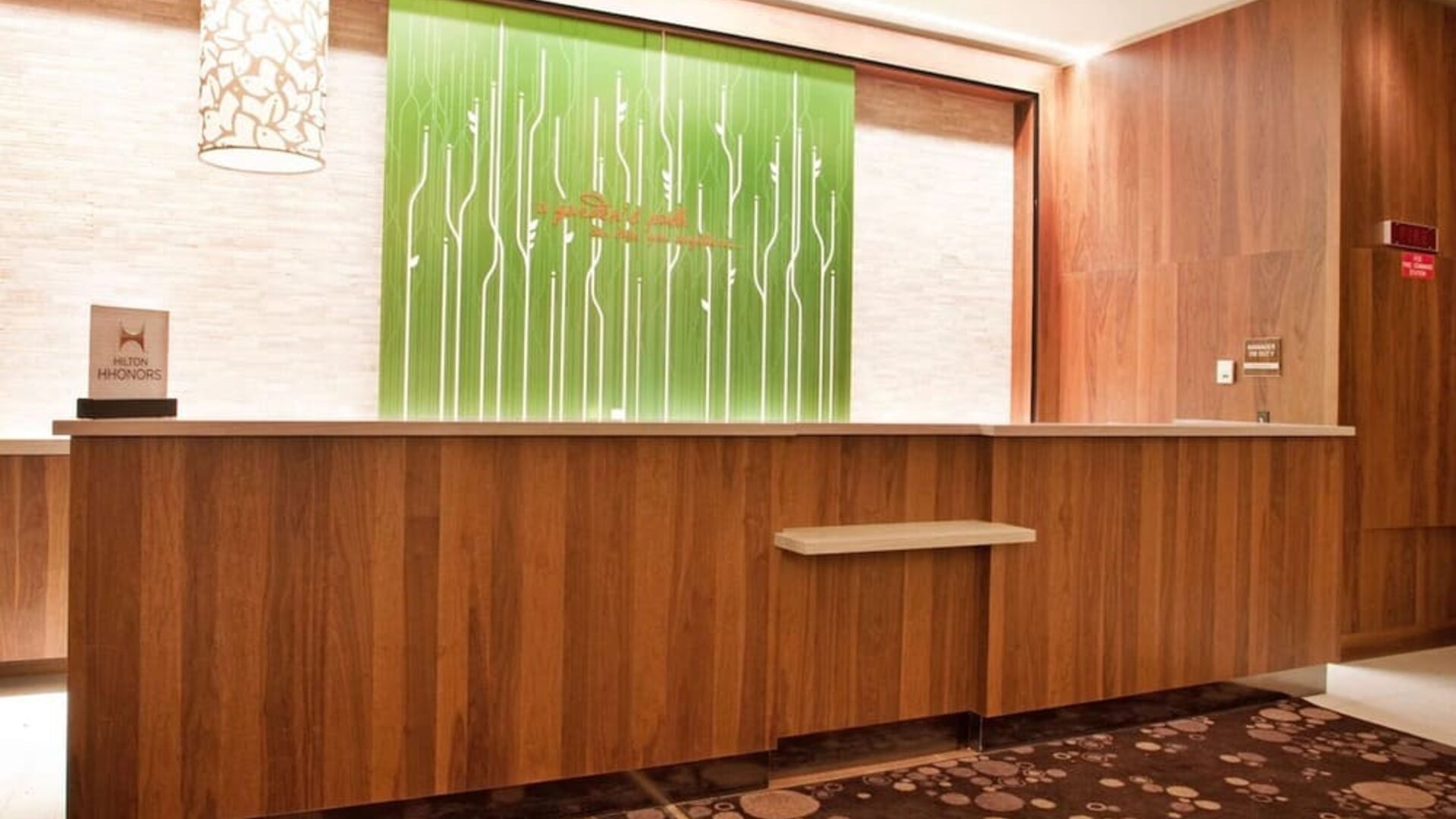 Contemporary reception desk and lobby area at Hilton Garden Inn New York Central Park South-Midtown West.
