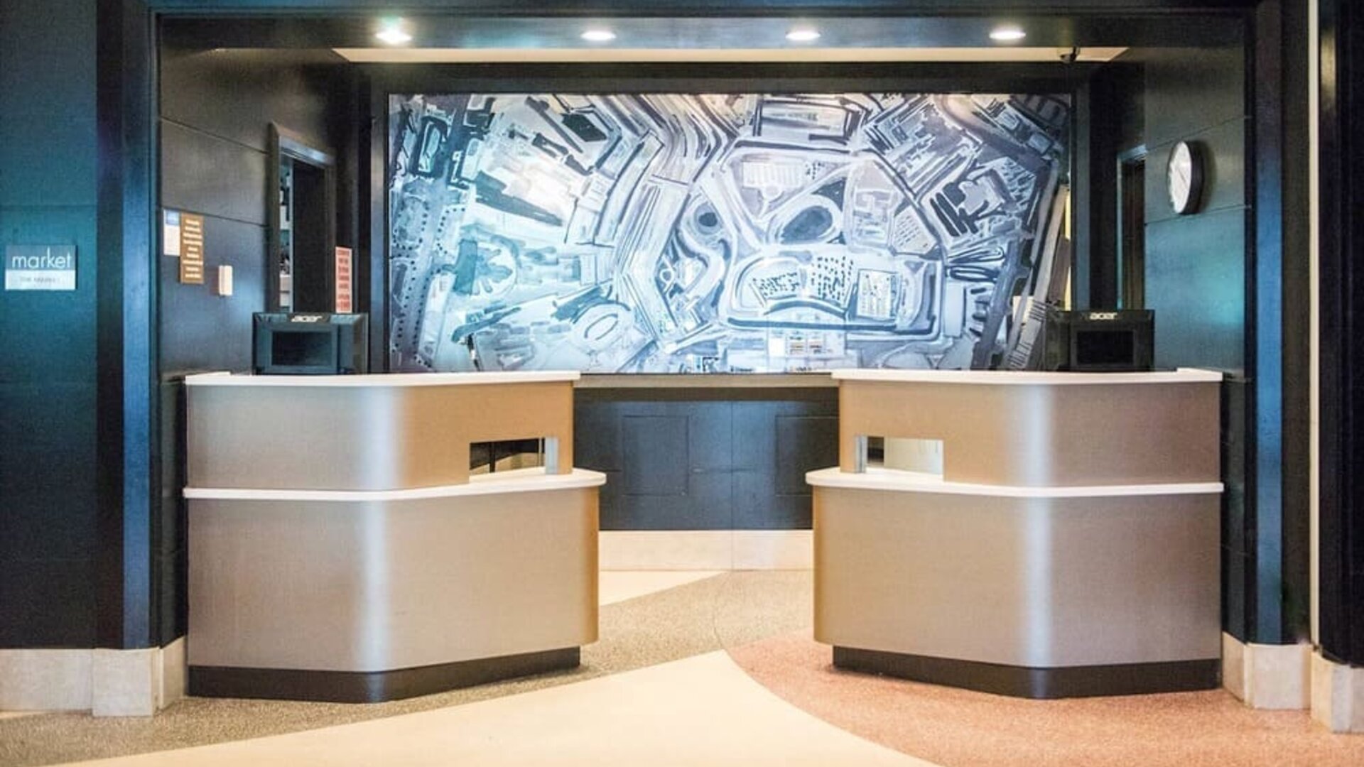 Modern reception desk and lobby area at Courtyard By Marriott New York JFK Airport.