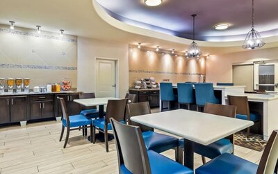 Bright dining area with breakfast seating at La Quinta Inn & Suites By Wyndham Houston Energy Corridor.