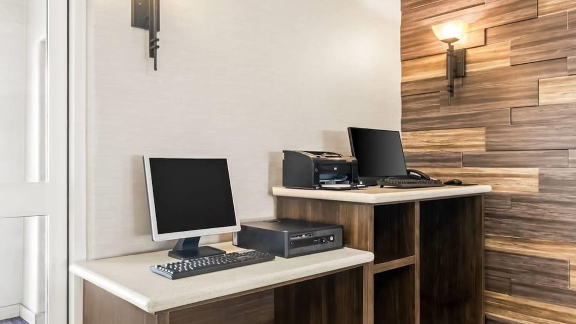 Business center with computers and printing facilities at La Quinta Inn & Suites By Wyndham Houston Energy Corridor.