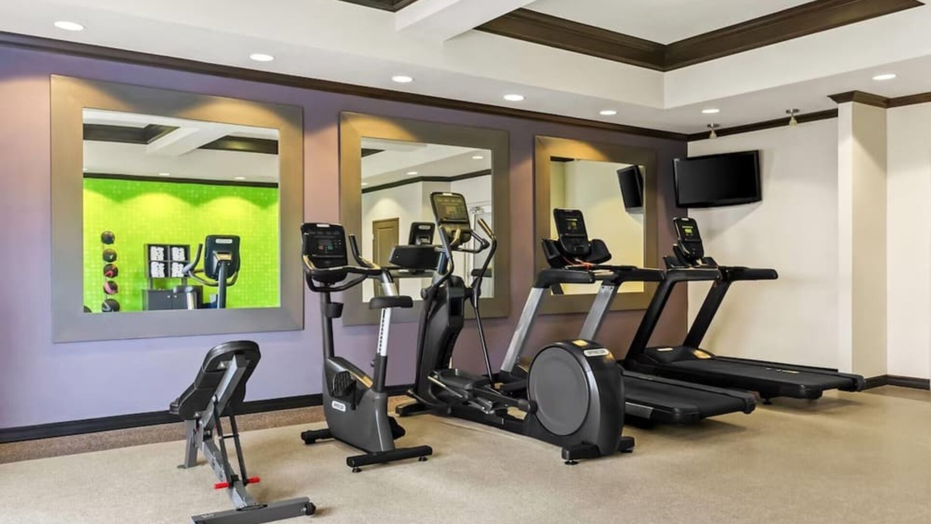 Fitness center with cardio equipment and workout space at La Quinta Inn & Suites By Wyndham Houston Energy Corridor.