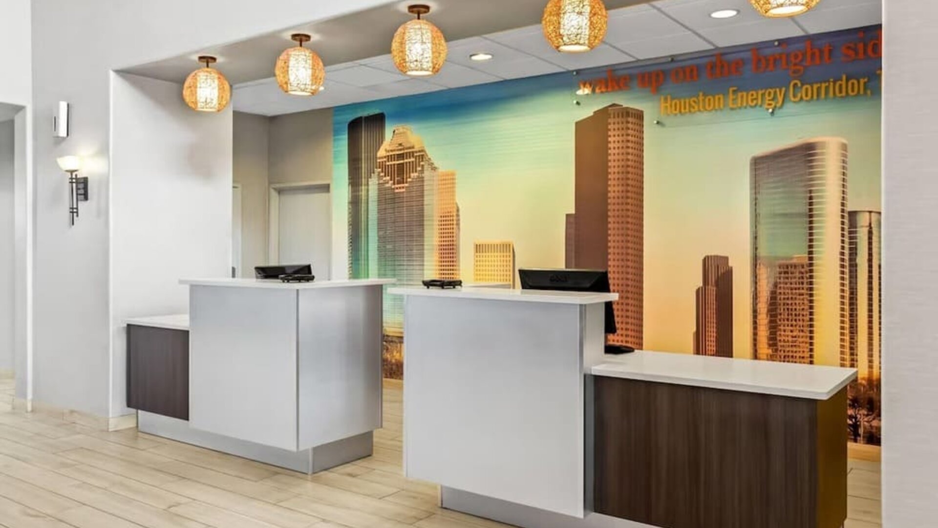 Reception desk and check-in area at La Quinta Inn & Suites By Wyndham Houston Energy Corridor.