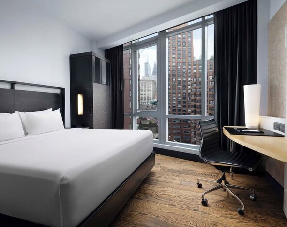 Guest room with skyline views and dedicated workspace at Hyatt Union Square New York.