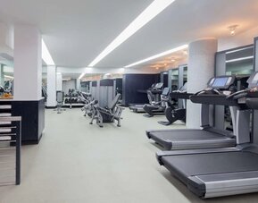 Spacious fitness facility with treadmills and strength-training equipment at Hyatt Union Square New York.