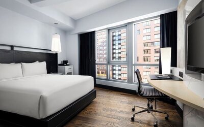 Modern king guest room with workspace and city views at Hyatt Union Square New York.